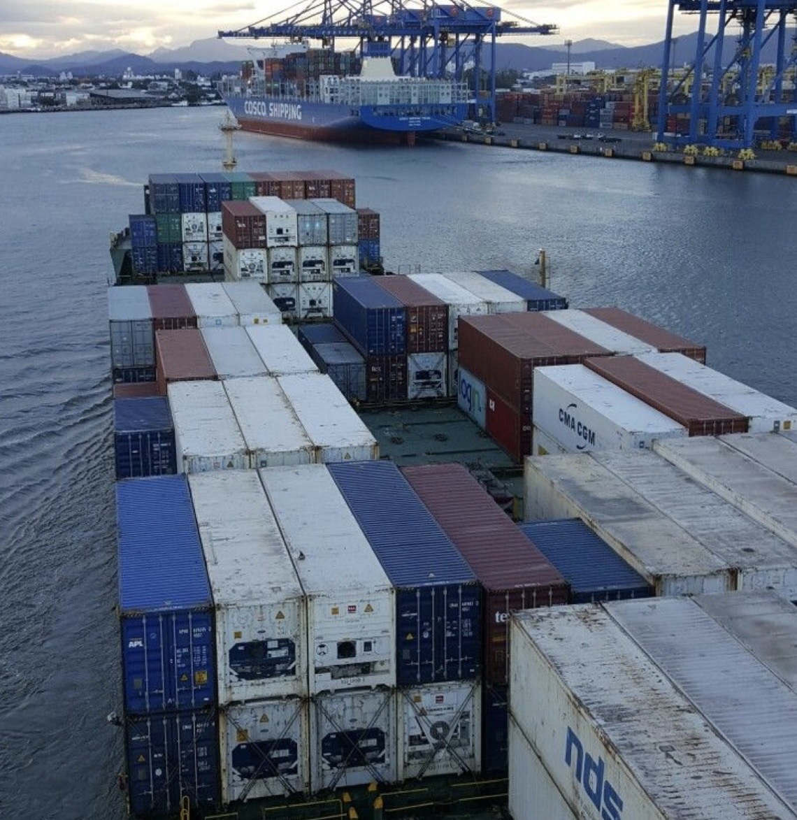 Container ship loaded with shipping containers at port